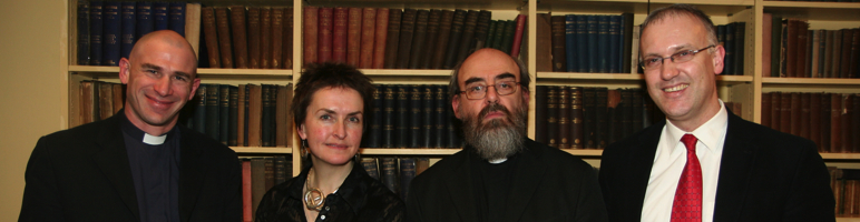 Novelist Catherine Fox (2nd left) and her husband Canon Peter Wilcox (left) speak in the Church of Ireland Theological Institute